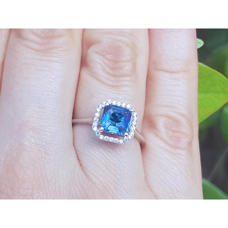 Asscher cut blue sapphire ring for women halo diamonds 18k white gold on a finger