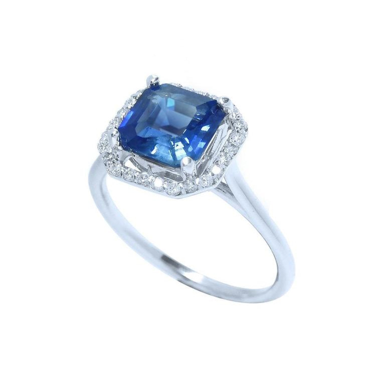 Asscher cut blue sapphire ring with halo diamonds in 18k white gold.