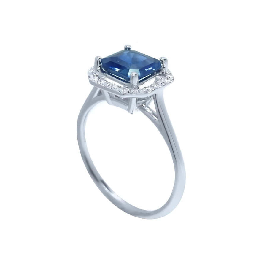 Asscher cut blue sapphire ring with halo diamonds in 18k white gold.