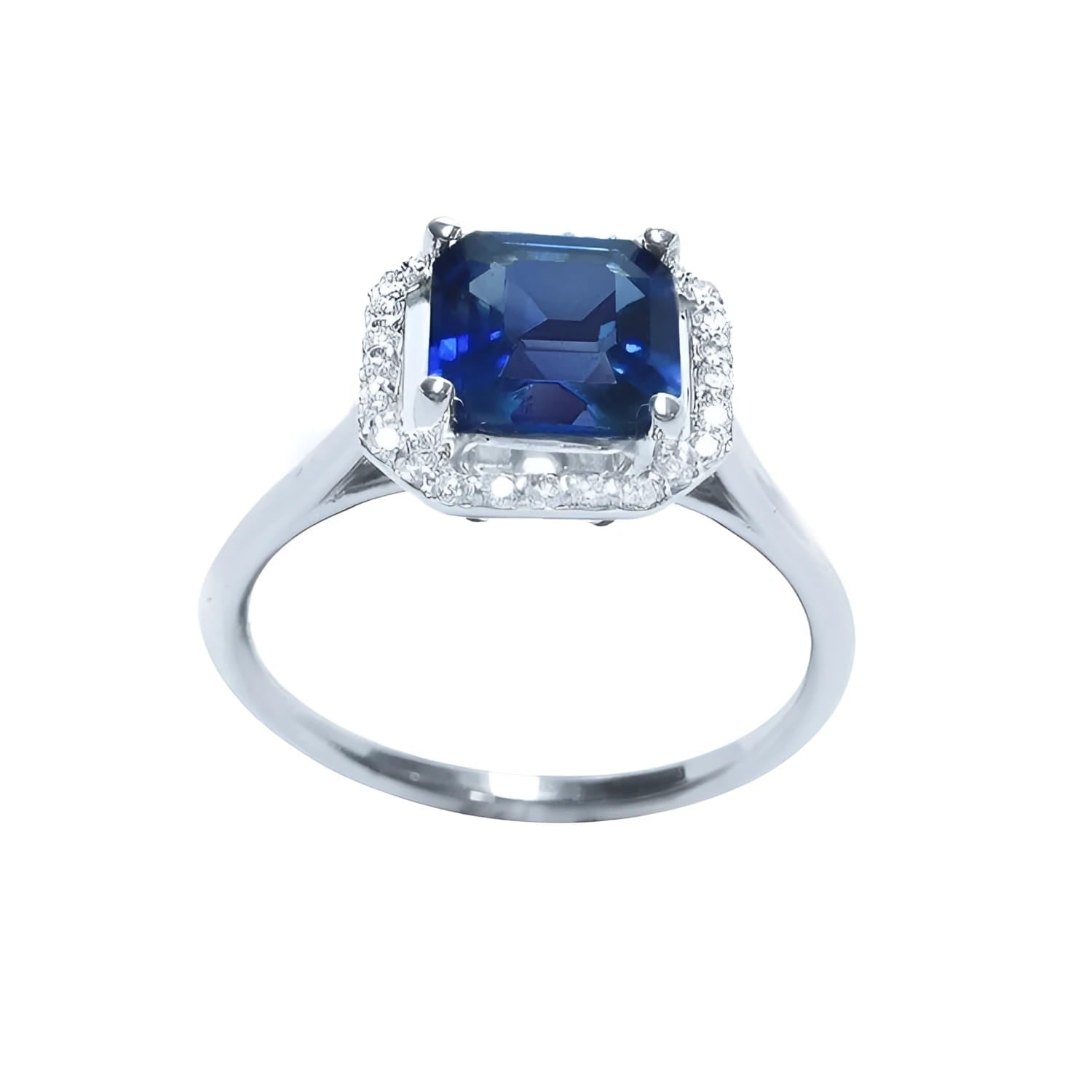 Asscher cut medium dark blue sapphire ring with halo diamonds in 18k white gold.