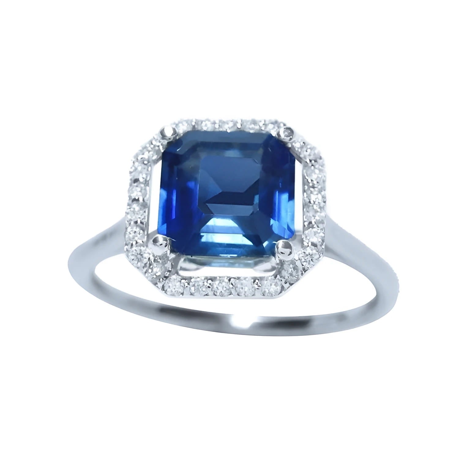 Asscher cut blue sapphire ring for women 18k white gold, sparkling medium dark blue color prong set with halo natural diamonds.