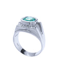 The lateral top setting and a partial side perspective of a mens emerald ring.
