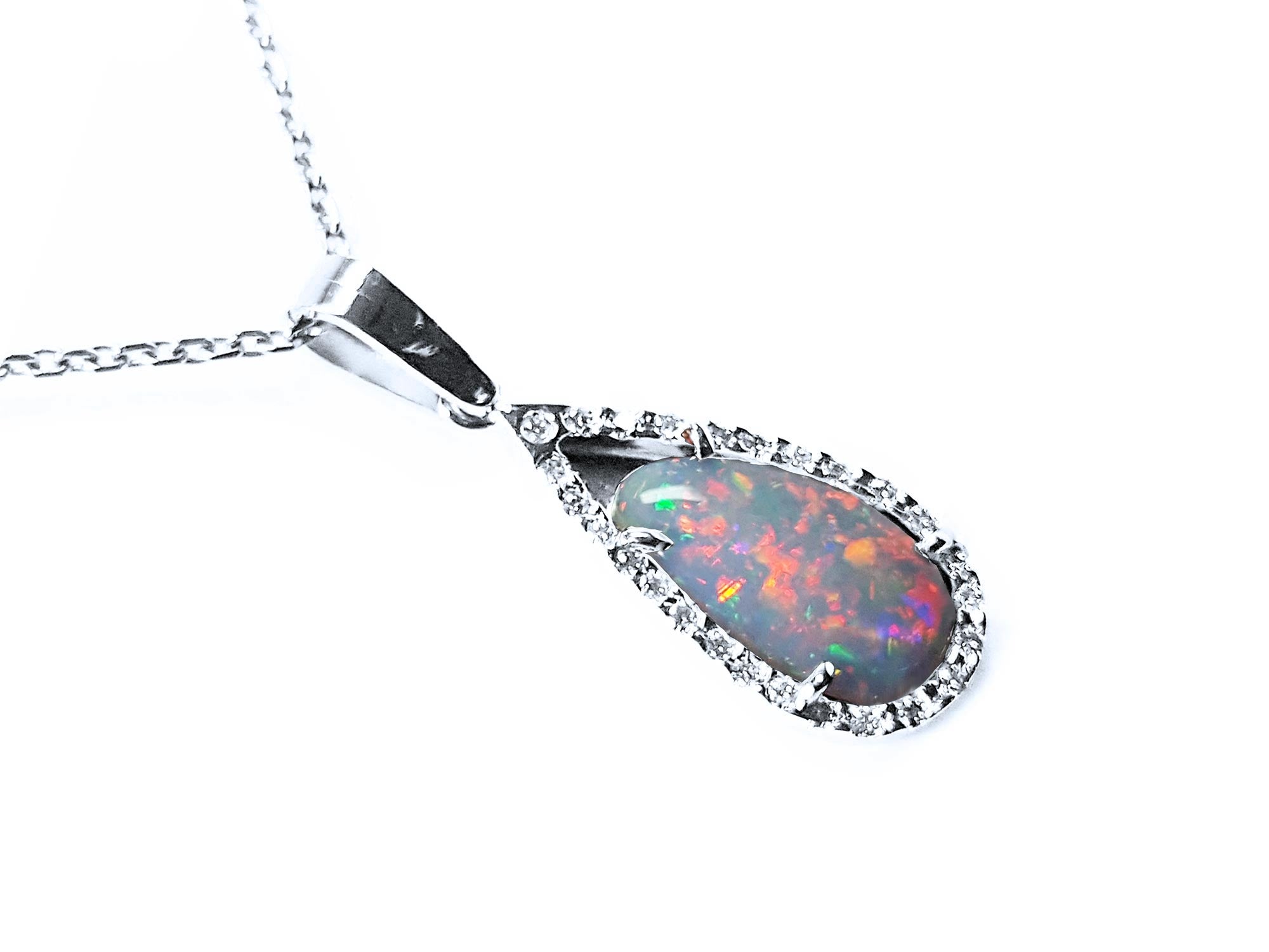 An 18k white gold pendant necklace featuring a pear-shaped Australian opal with a multicolored play of colors.