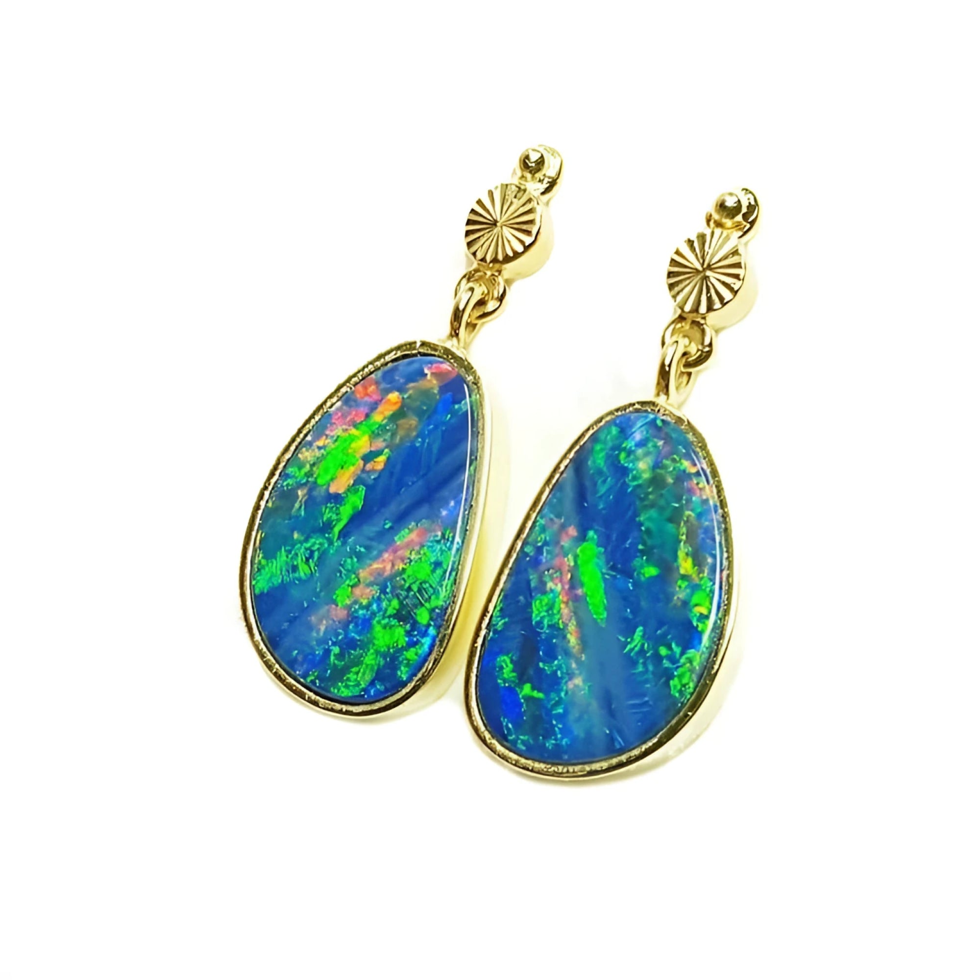 Vibrant blue Australian opal doublet dangle earrings in 14K yellow gold with bezel settings.