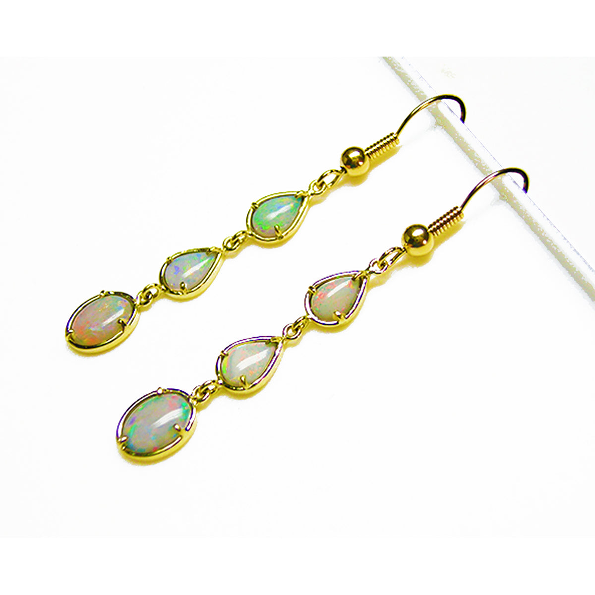 A 14k yellow gold pair of earrings with opal stones on a white background.