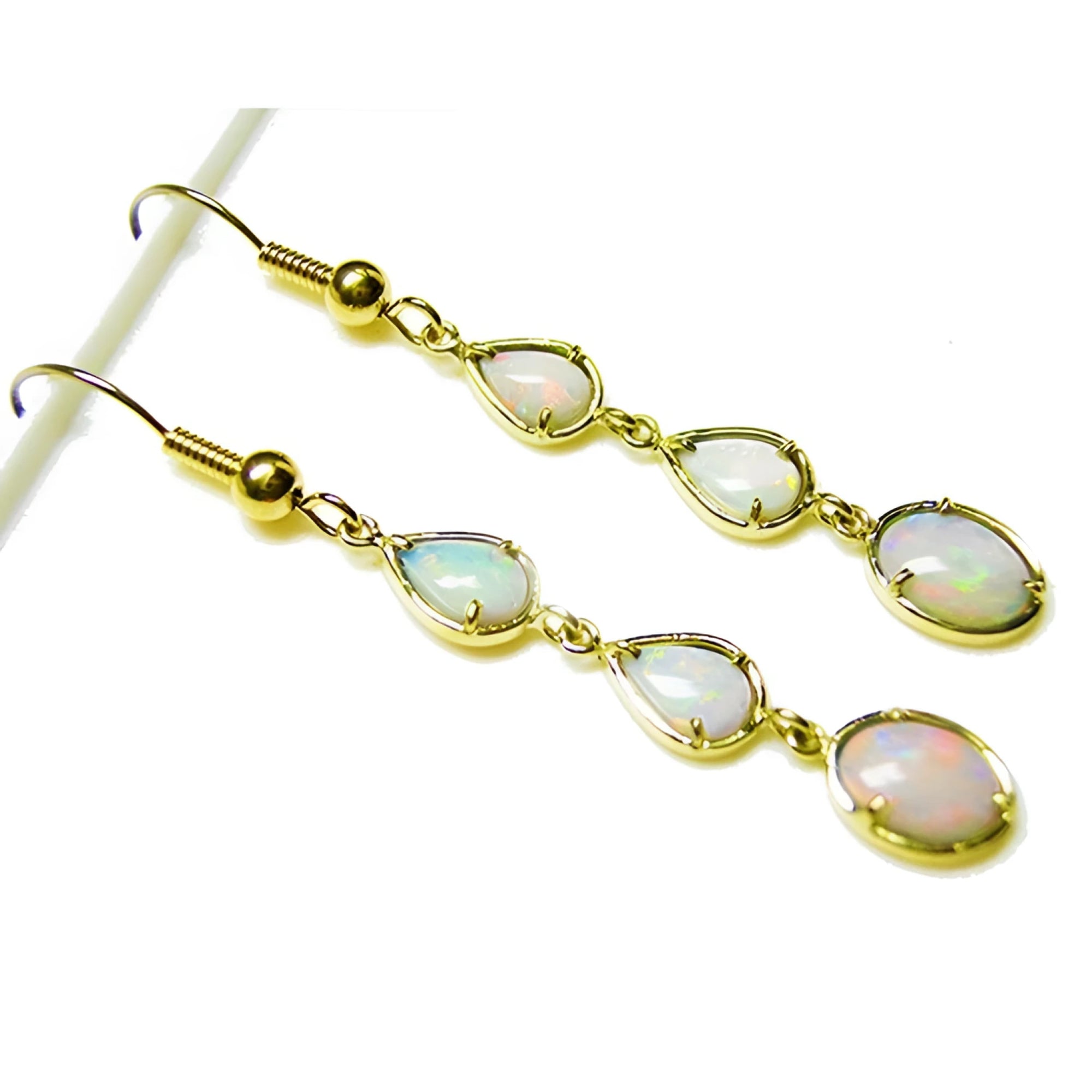Handcrafted 14k yellow gold dangle earrings with three pear and oval-shaped natural Australian opals.