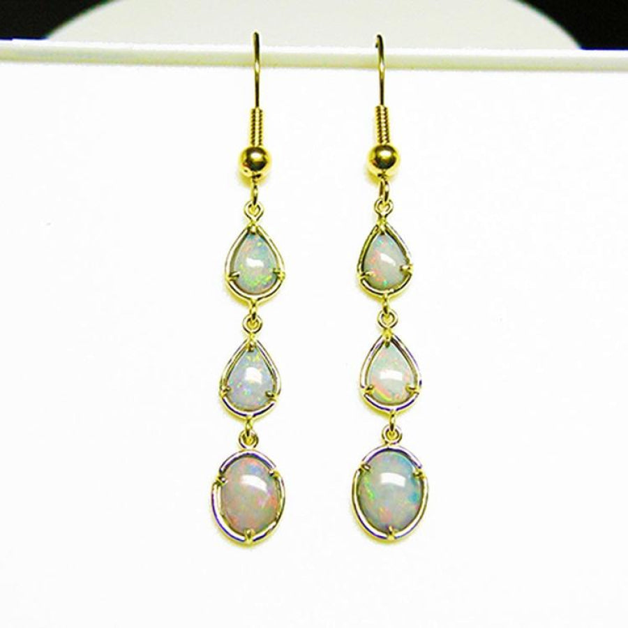 Pear and oval Australian opal dangle earrings in 14k yellow gold.