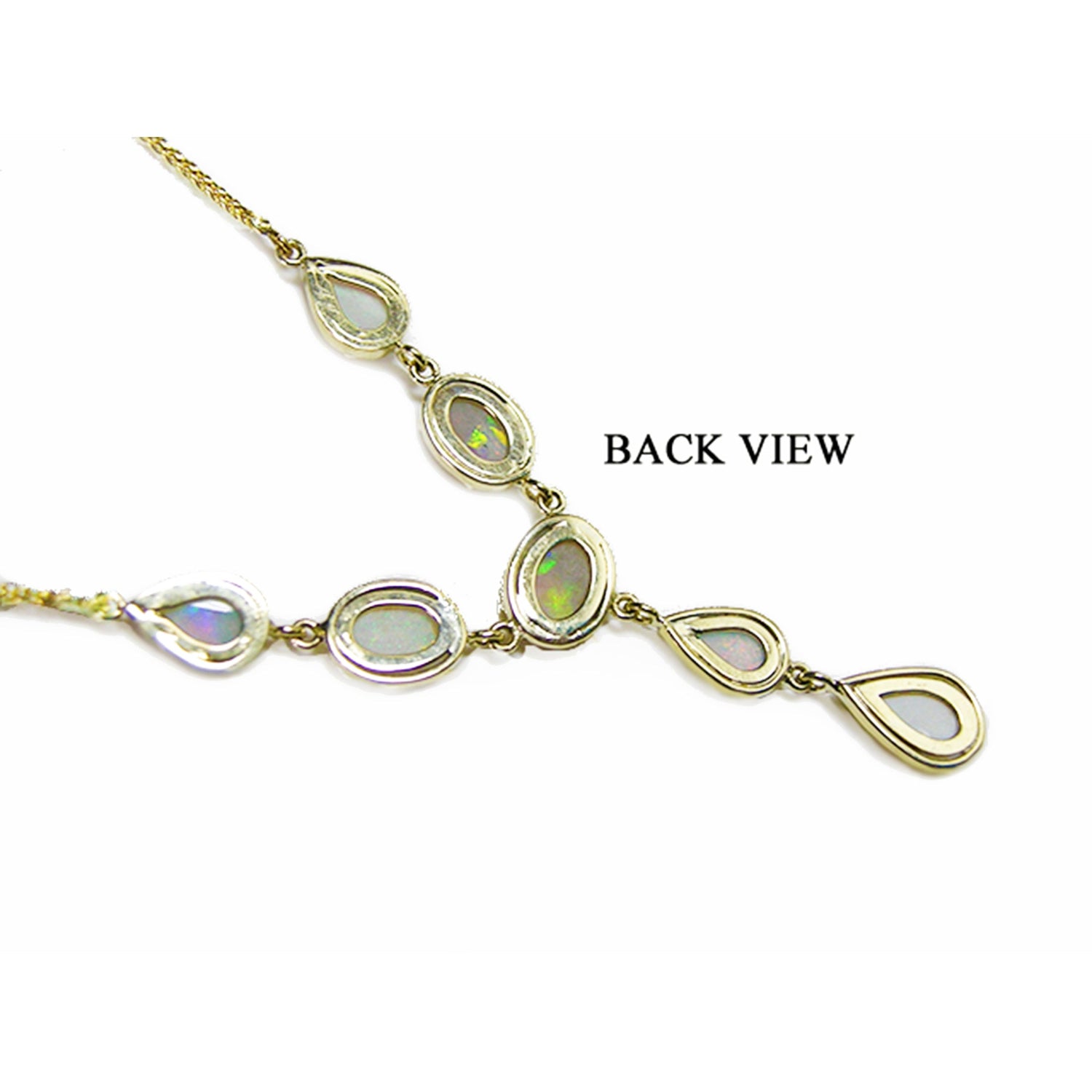 Gold necklace with opal stones on a upside down position to display its back side view.