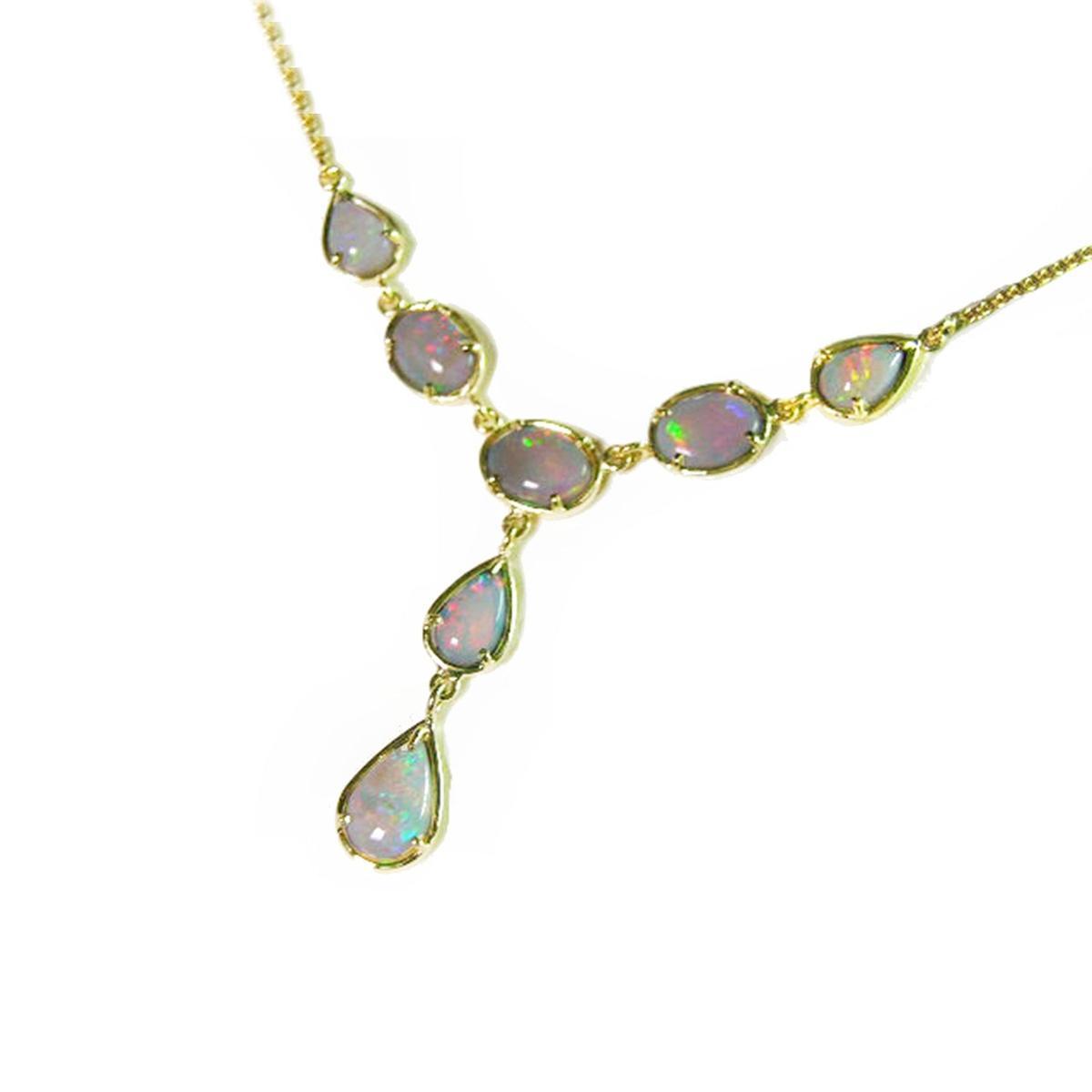 A solid Australian opal necklace with gold chain on a left-side profile view position.