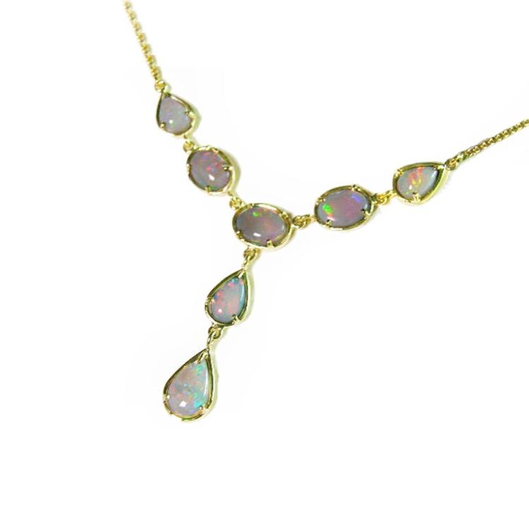 A solid Australian opal necklace with gold chain on a left-side profile view position.