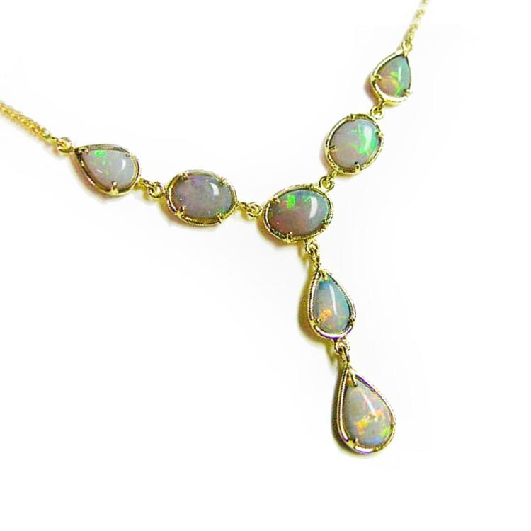 Gold necklace with natural solid Australian opal stones on a right-side view position.