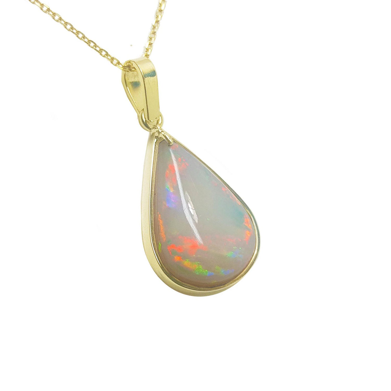 A natural Australian opal pendant pear shaped on a gold chain displaying its topside right profile.