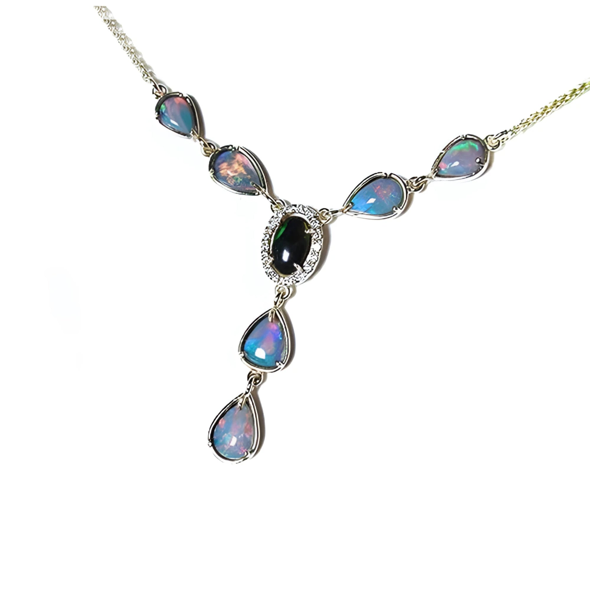 14k yellow gold Australian black opal and diamond halo necklace with pear-shaped opals.