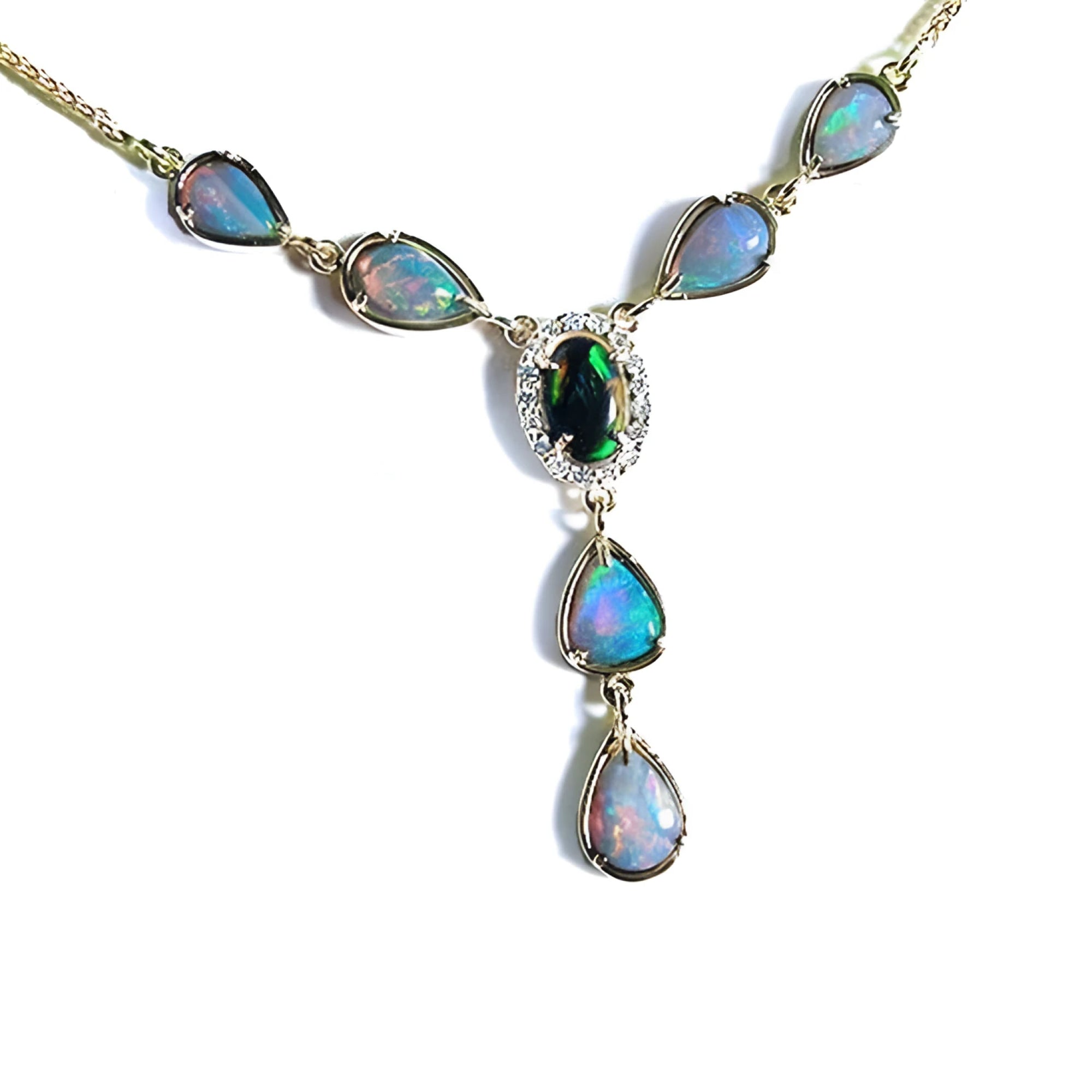 14k yellow gold necklace with a black Australian opal haloed by diamonds, and seven pear-shaped opals.