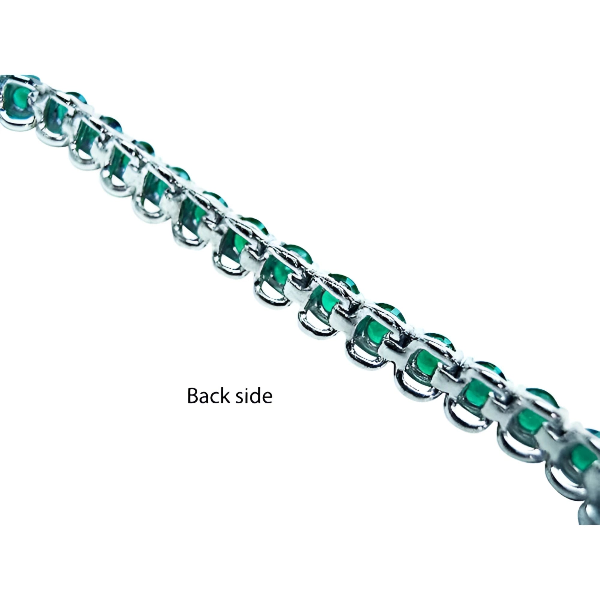 Back view of a Colombian emerald tennis bracelet in 14K white gold, showing the setting.