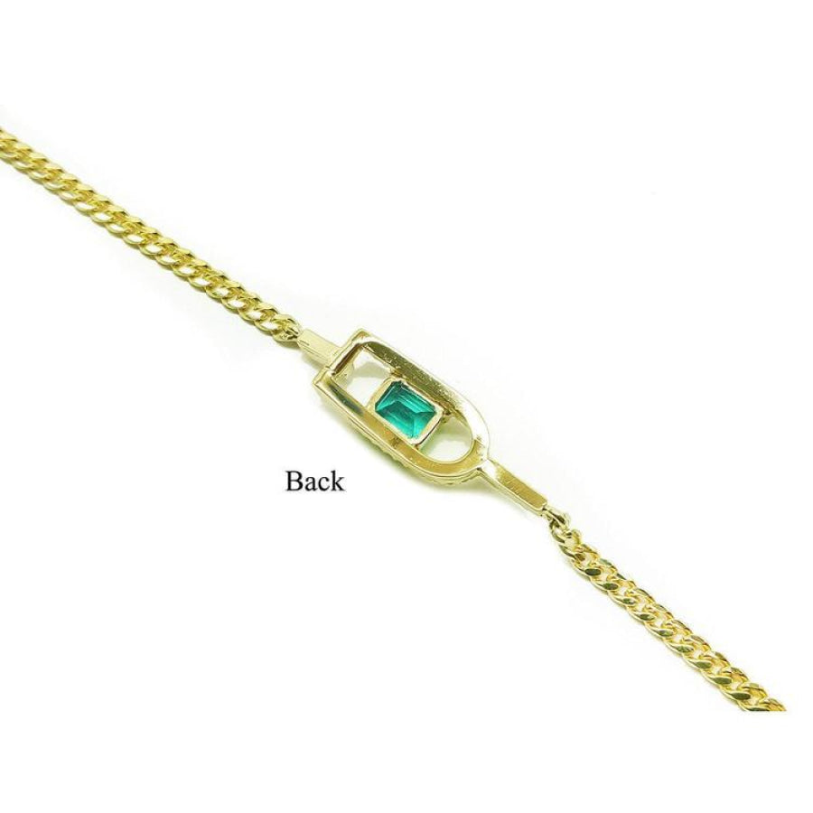 14K yellow gold bracelet with a square emerald-cut Colombian emerald.
