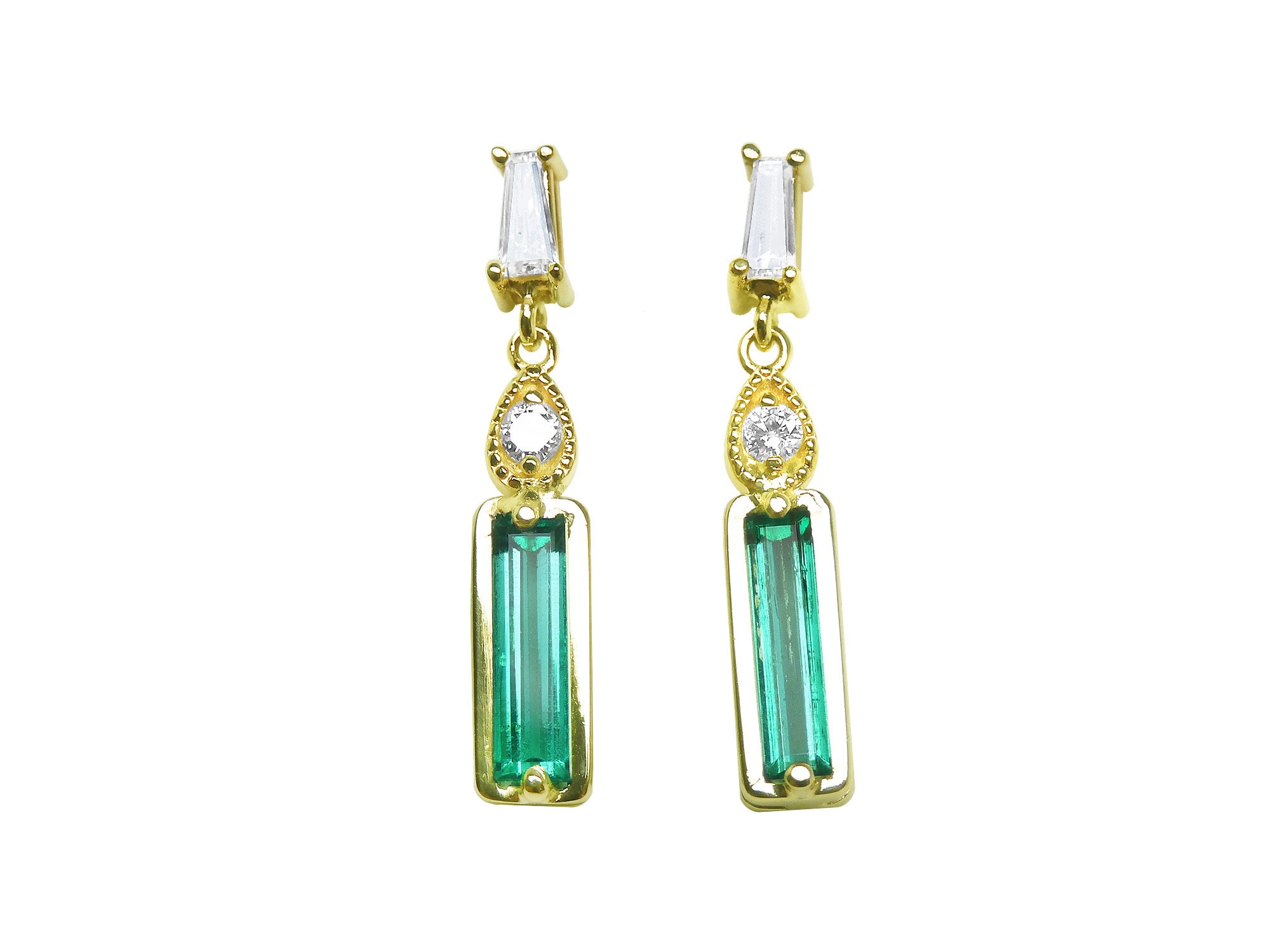 Front position of a baguette cut emerald and diamond pair of earrings in 14k yellow gold, top side view