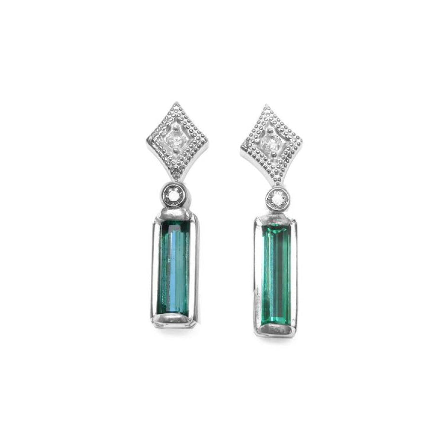 14K white gold emerald baguette and diamond stud earrings.