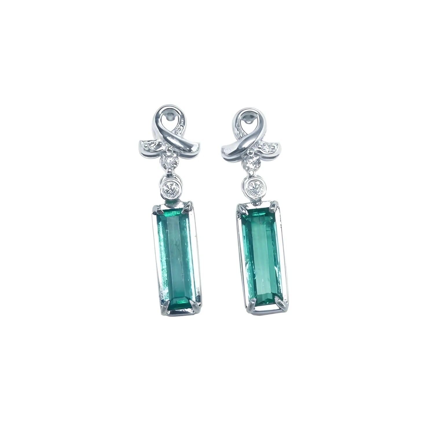 Emerald-cut natural emerald earrings in 14k white gold with diamond ribbon design.