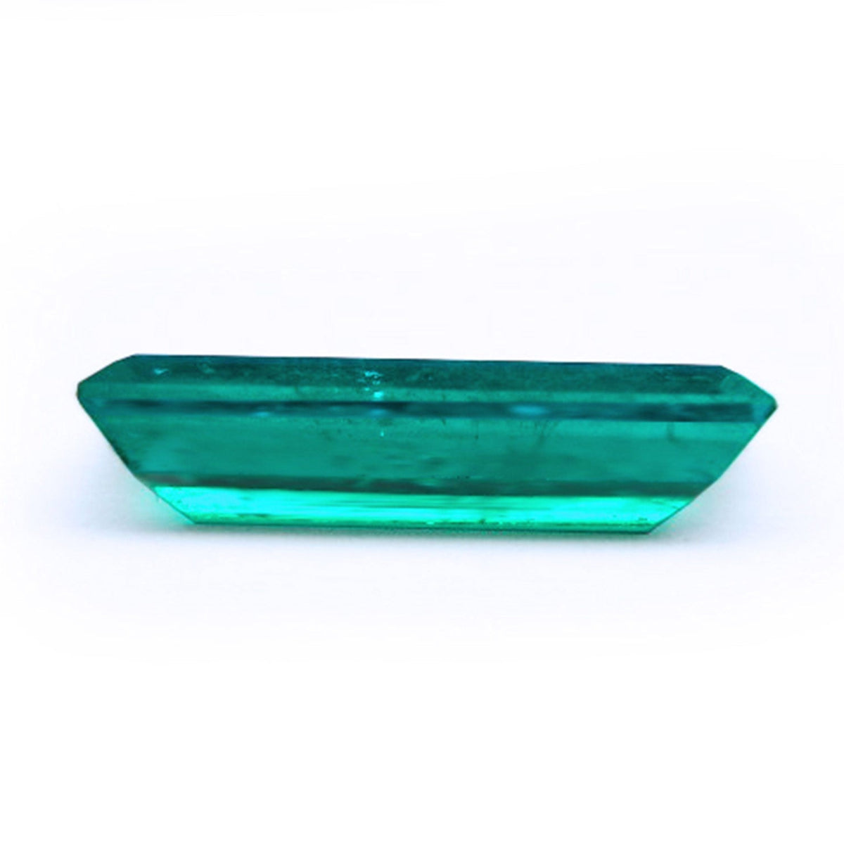 Baguette cut loose emerald for sale displaying downside pavilion