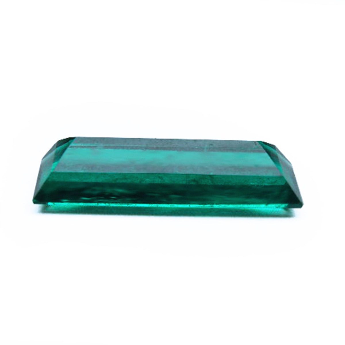 Baguette cut loose emerald for sale displaying upside down view