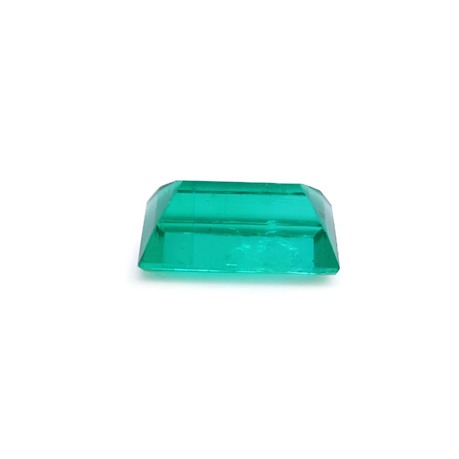 1.62 ct. baguette-cut natural emerald with vibrant green color and clear facets.