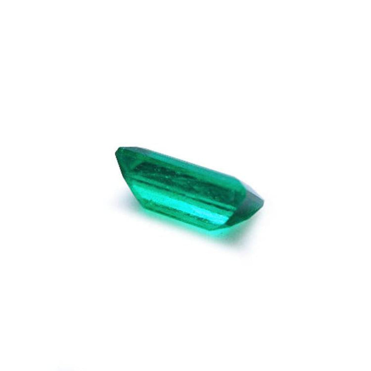 1.10 ct. baguette cut loose Colombian emerald with vibrant green color and lively brilliance.