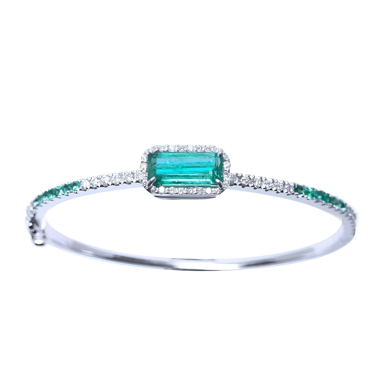 
A bangle bracelet with natural colombian emeralds and diamonds crafted in 14l in white gold.