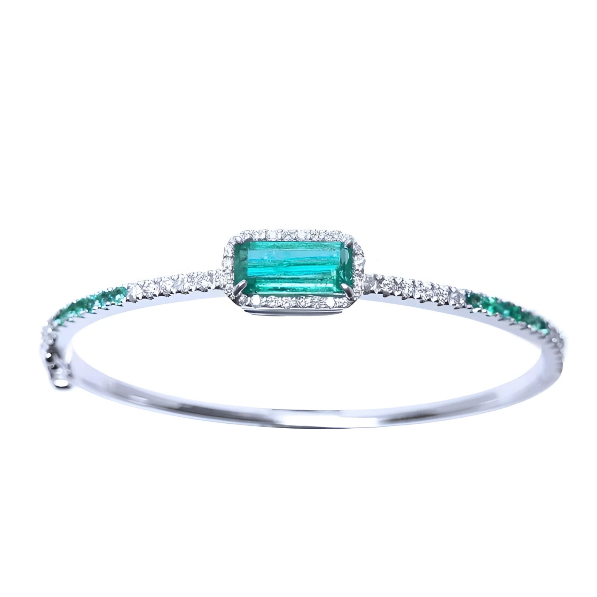 
A bangle bracelet with natural colombian emeralds and diamonds crafted in 14l in white gold.