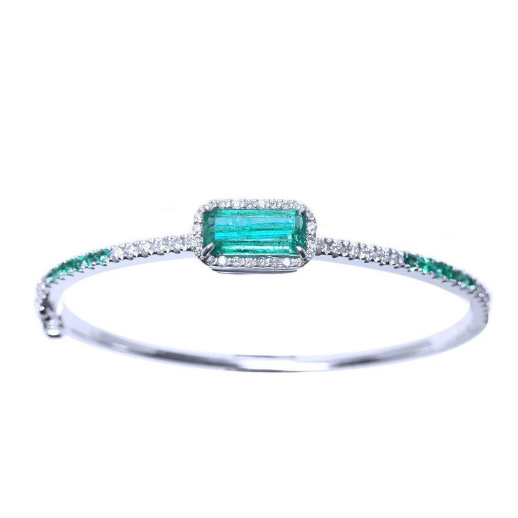 
A bangle bracelet with natural colombian emeralds and diamonds crafted in 14l in white gold.