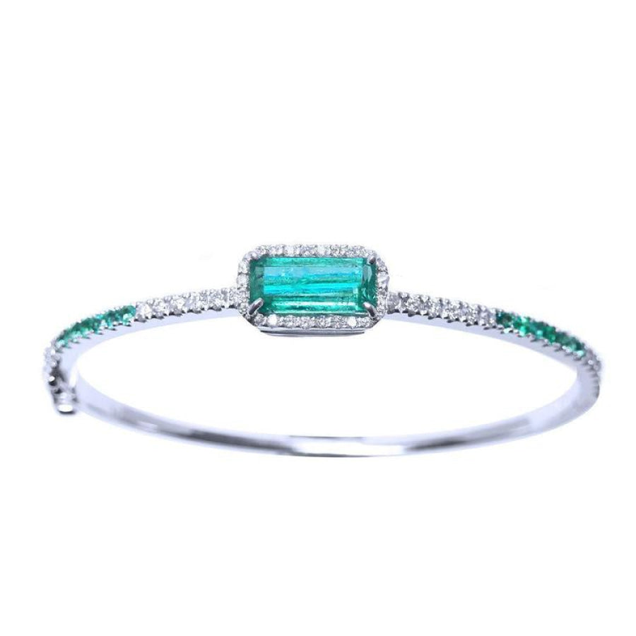 
A bangle bracelet with natural colombian emeralds and diamonds crafted in 14l in white gold.