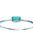 
A bangle bracelet with natural colombian emeralds and diamonds crafted in 14l in white gold.