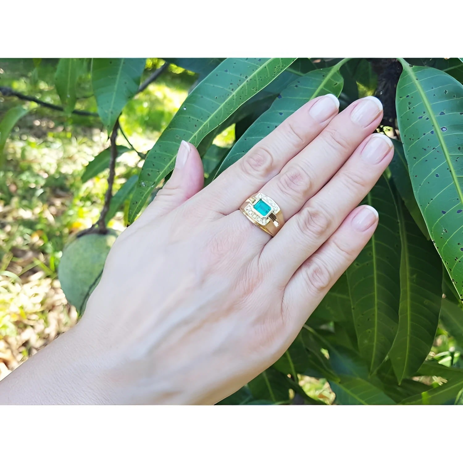 14K yellow gold men's ring with a 1.21 ct. east-west emerald bezel setting and diamond accents.