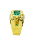 The side profile of a yellow gold emerald ring for men shows the top and band design.