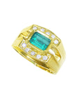 The tilted position of this men's emerald ring in yellow gold shows the top and side profile view.