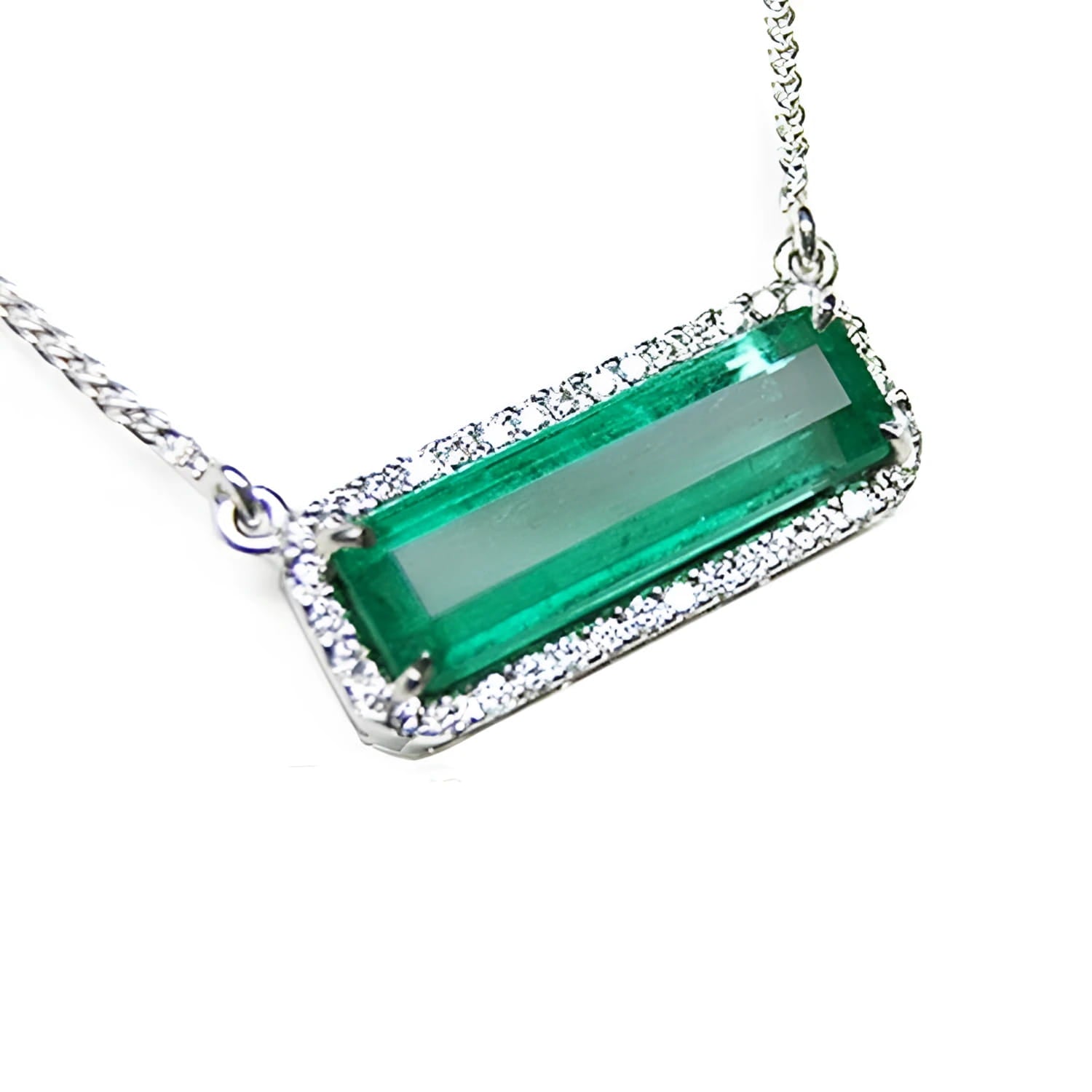 Elongated colombian emerald gemstone necklace encircled in a halo natural diamonds with white gold chain.