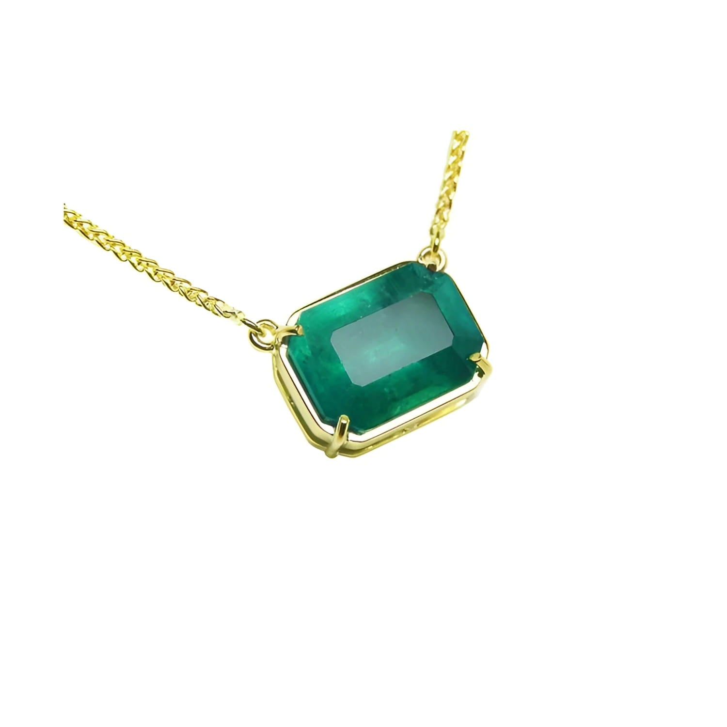 5.52 carat emerald-cut Colombian emerald solitaire necklace in 18K yellow gold.