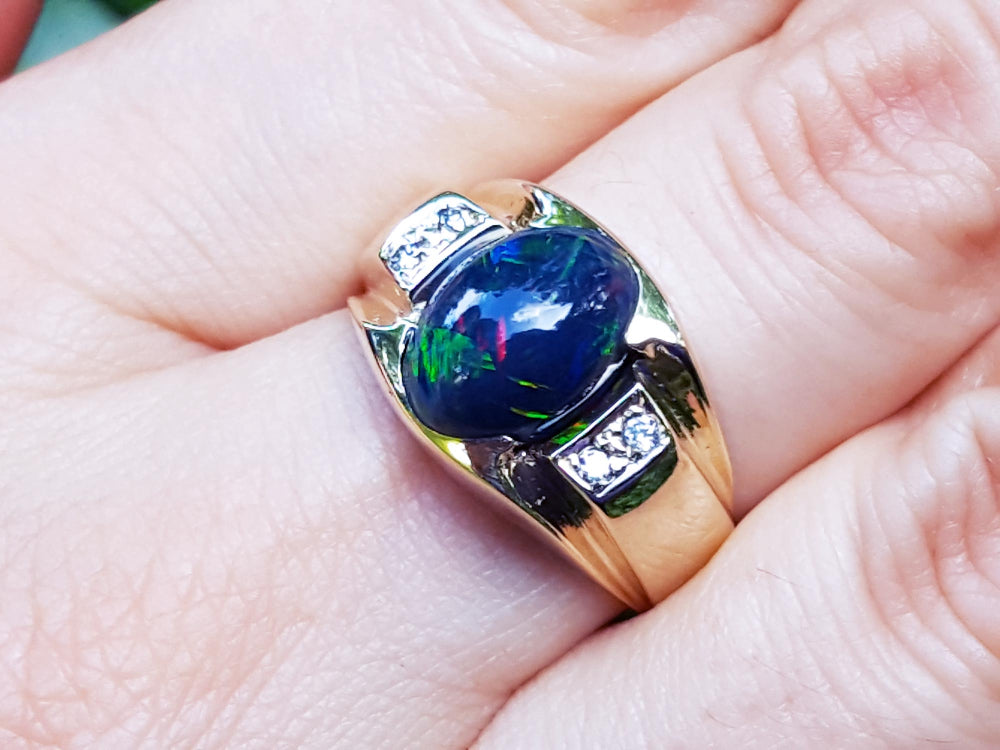Natural black opal ring for man oval cabochon cut low dome 2.41 carats, elegantly set in 14k solid yellow gold