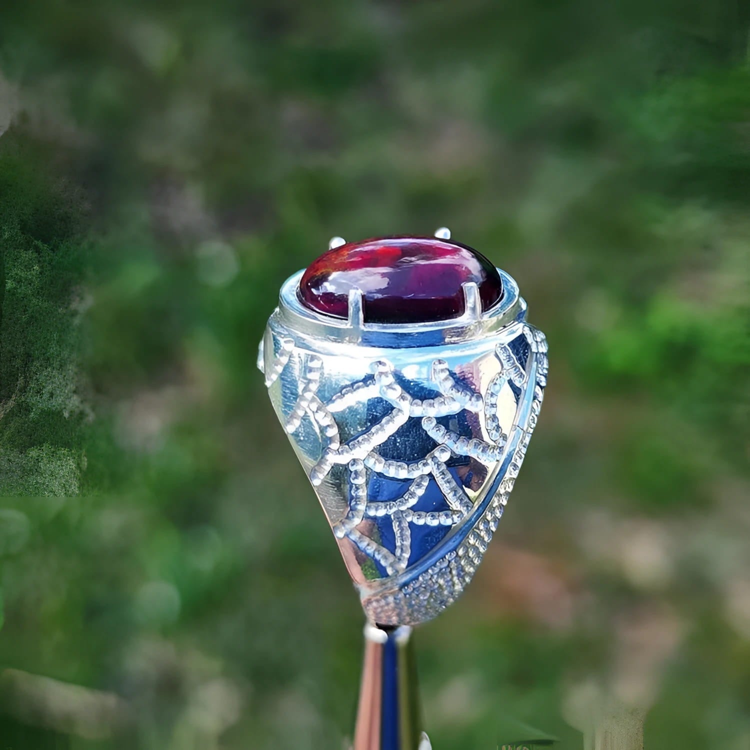 Men's black Ethiopian opal ring in 925 sterling silver with red-orange and blue hues.