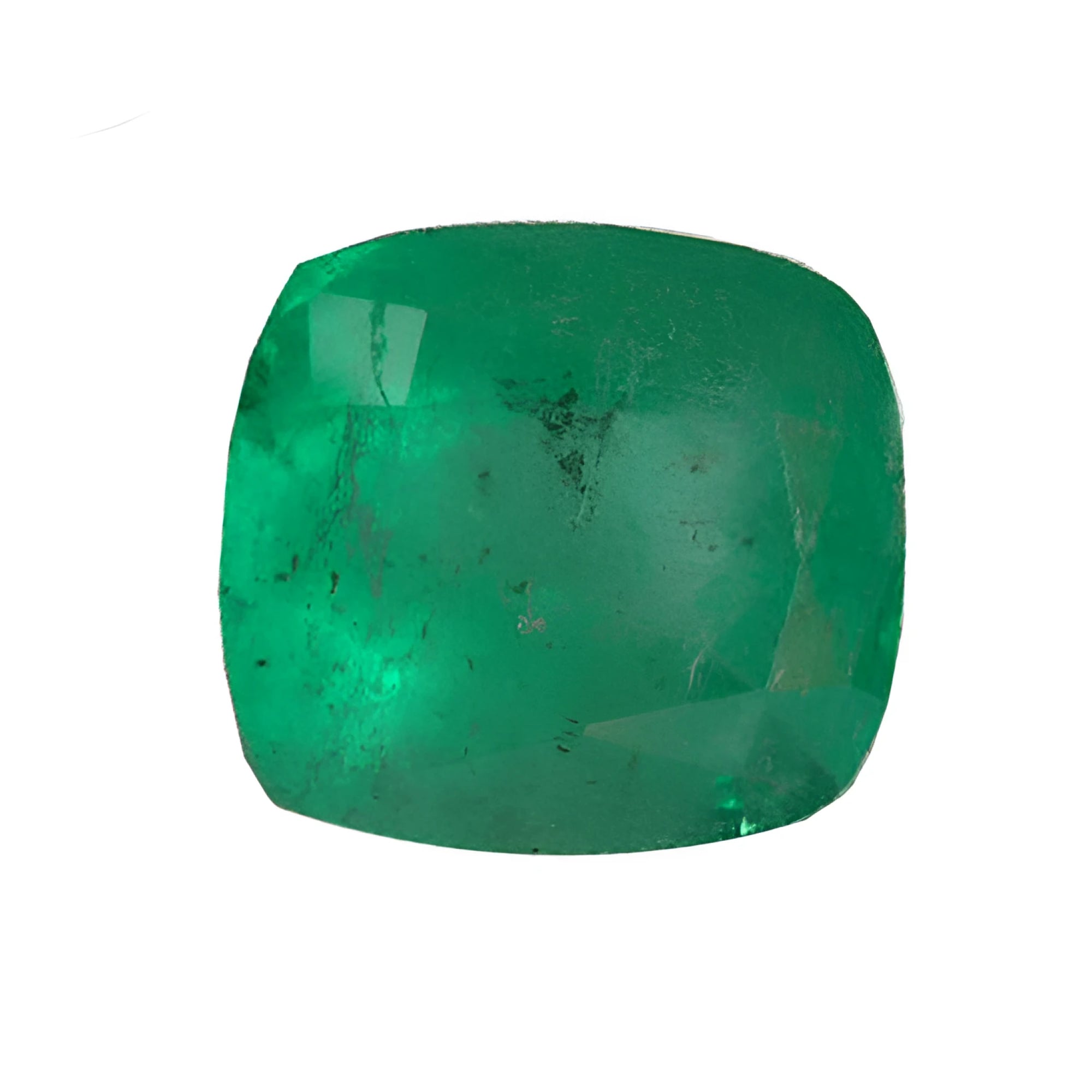 Cushion-shaped emerald moderately included with pirita and carbon spots.