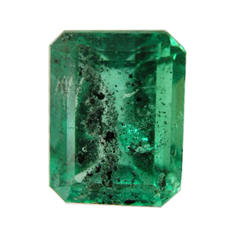 Rectangular emerald gemstone heavily included with pirita and carbon spots.