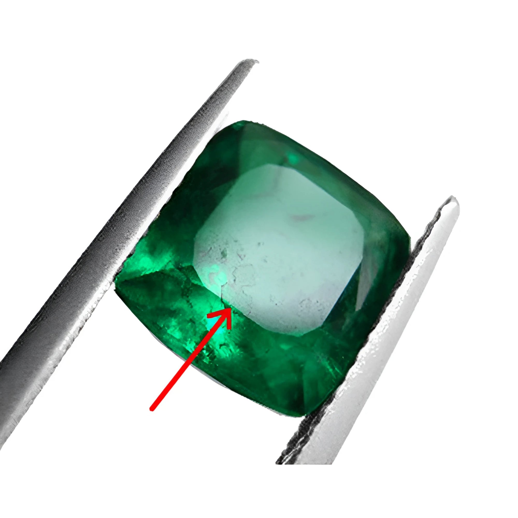 Emerald with a red arrow pointing to a synthetic filled flaw, held by tweezers.