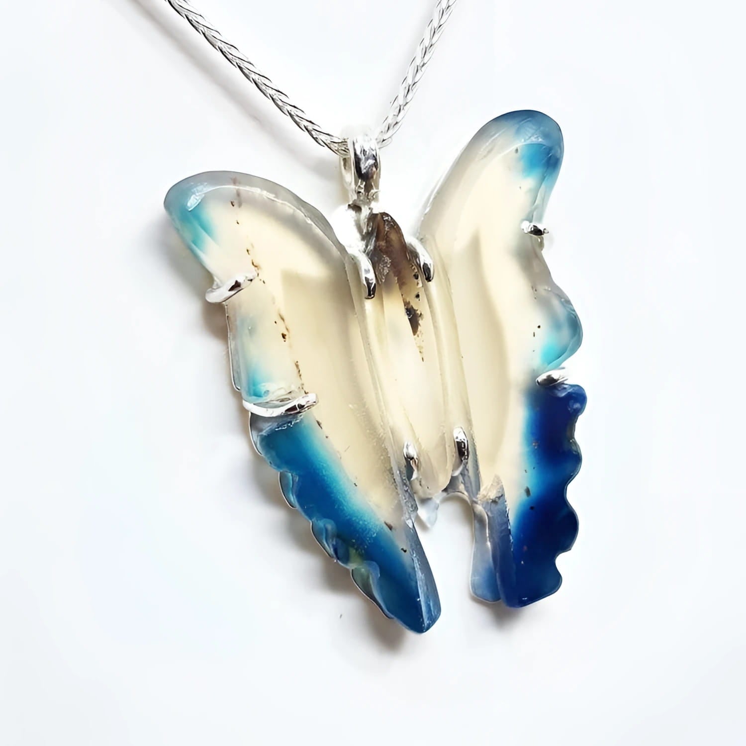 Hand-carved natural blue agate butterfly pendant necklace with sterling silver chain.