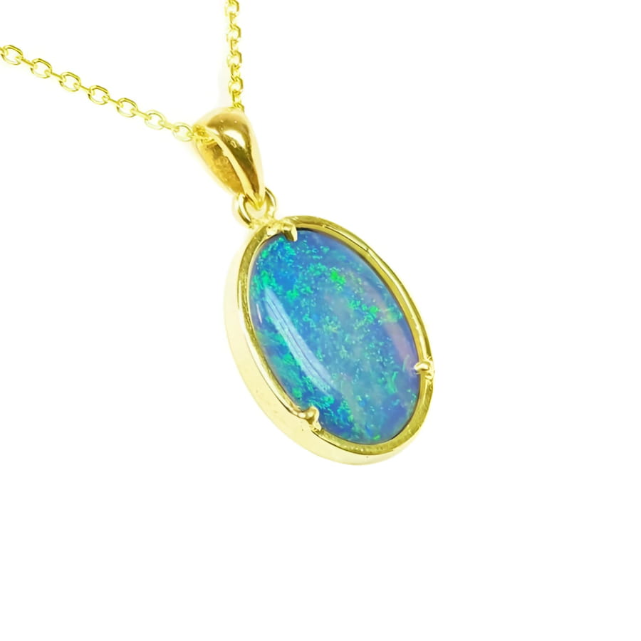 Oval 3.43 ct Australian opal pendant with blue-green sparks, handcrafted in 14K yellow gold.