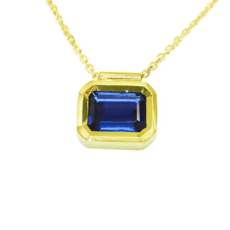 1.01 ct medium-dark blue sapphire choker, bezel set in 14K gold on a cable chain.