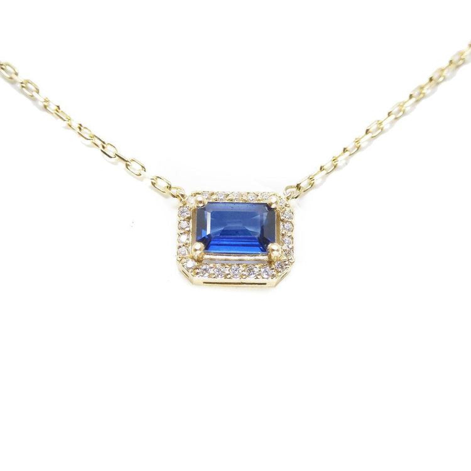 14K yellow gold necklace with an east-west emerald cut blue sapphire surrounded by diamonds.