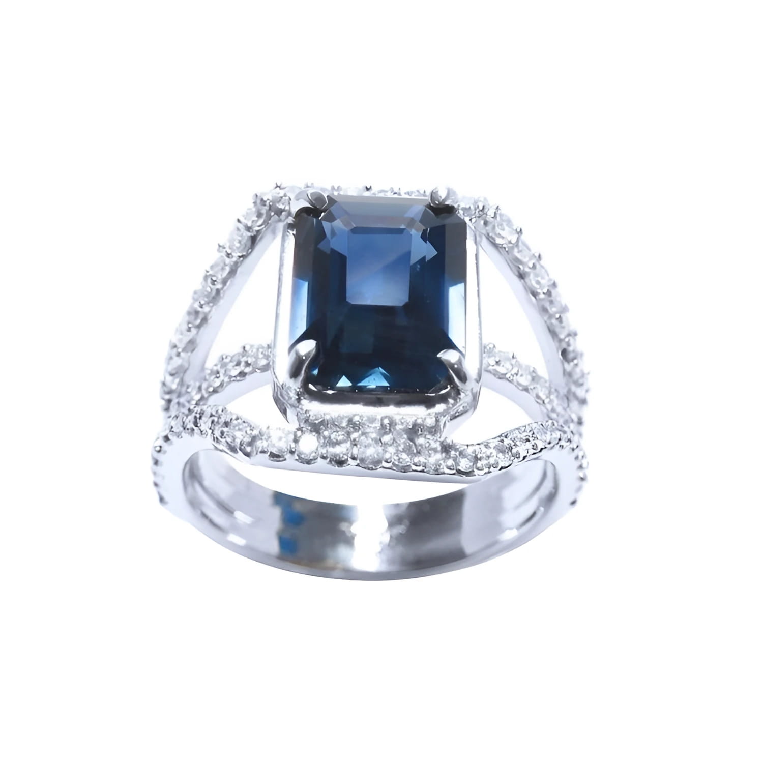 Emerald cut 4.51 ct. blue sapphire ring with a three-row diamond 18K gold band.