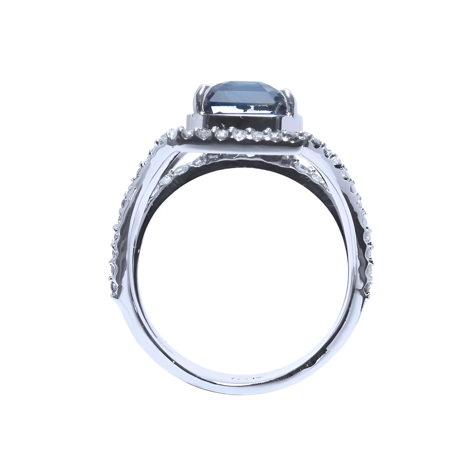 18K gold ring with a 4.51 ct emerald cut blue sapphire and a three-row diamond band.