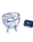 18k white gold ring mounting with accent diamonds and a blue natural sapphire aside