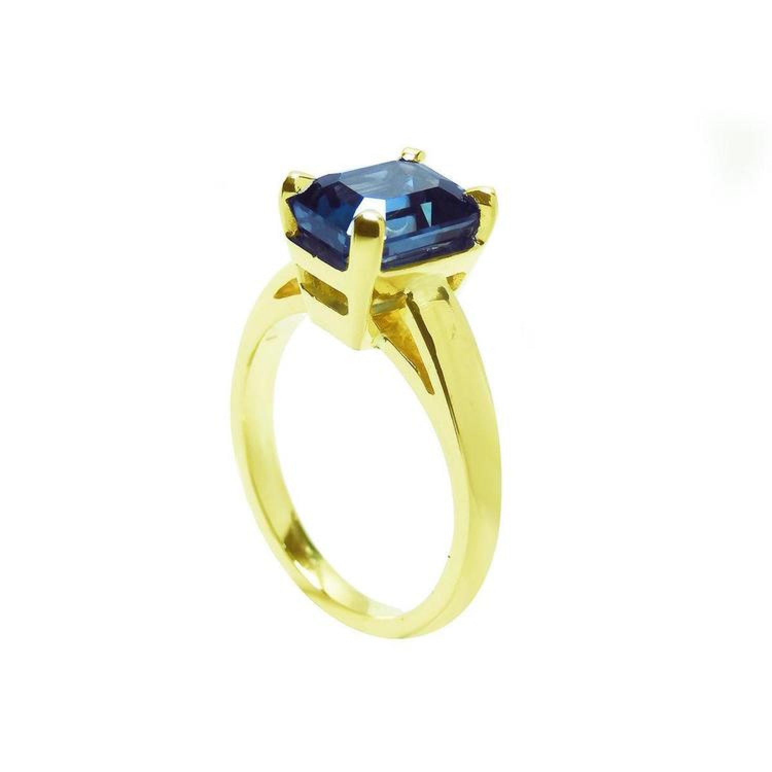 3.13 ct. deep blue emerald-cut sapphire solitaire ring in 14K yellow gold.
